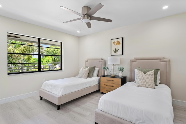 20 Southport Ln Unit D, Boynton Beach, FL 33436 - bedroom with light wood-style floors, recessed lighting, and a ceiling fan