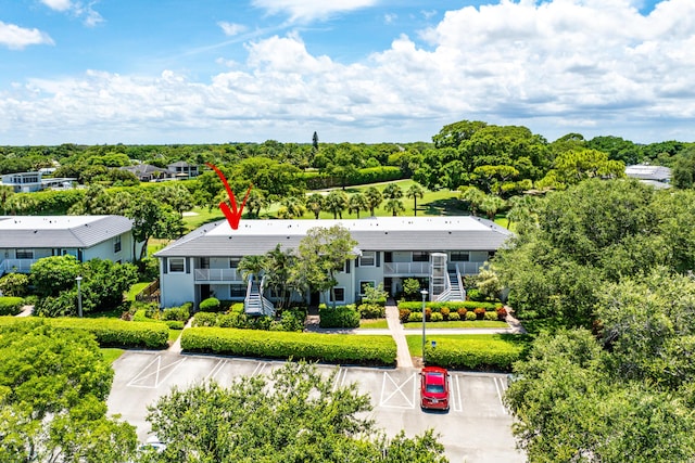 20 Southport Ln Unit D, Boynton Beach, FL 33436 - view of subject property featuring a tree filled landscape
