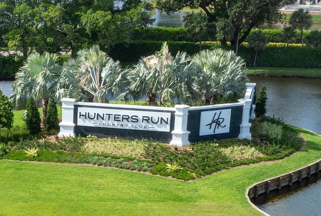 20 Southport Ln Unit D, Boynton Beach, FL 33436 - community sign with a water view and a yard