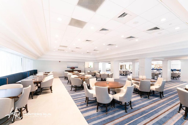 20 Southport Ln Unit D, Boynton Beach, FL 33436 - dining room featuring carpet, ornate columns, and a raised ceiling