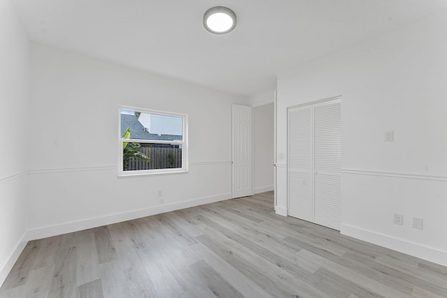 23157 Old Inlet Bridge Dr, Boca Raton, FL 33433 - unfurnished bedroom with light wood finished floors and a closet