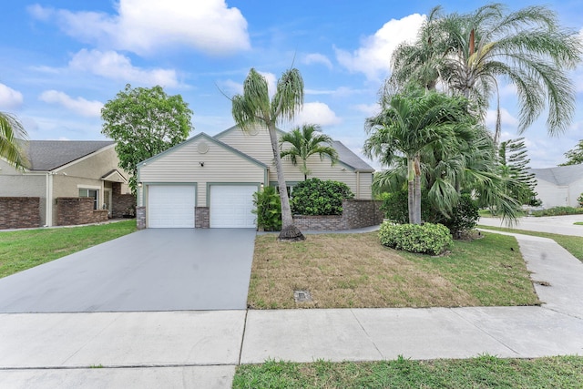 23157 Old Inlet Bridge Dr, Boca Raton, FL 33433 - view of front facade with driveway, a front yard, and a garage