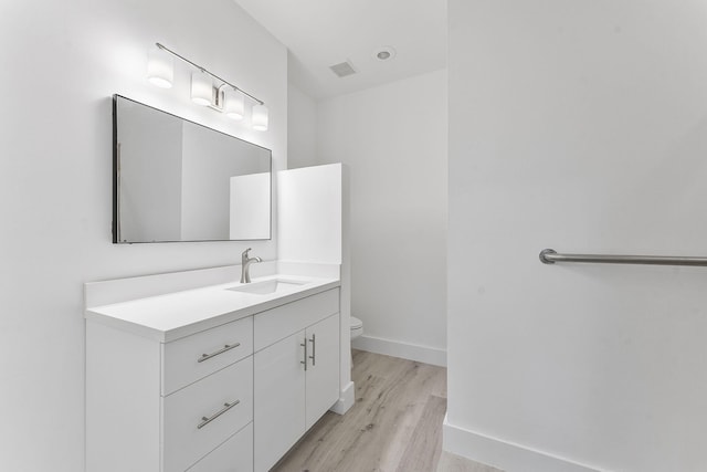 23157 Old Inlet Bridge Dr, Boca Raton, FL 33433 - bathroom with wood finished floors and vanity