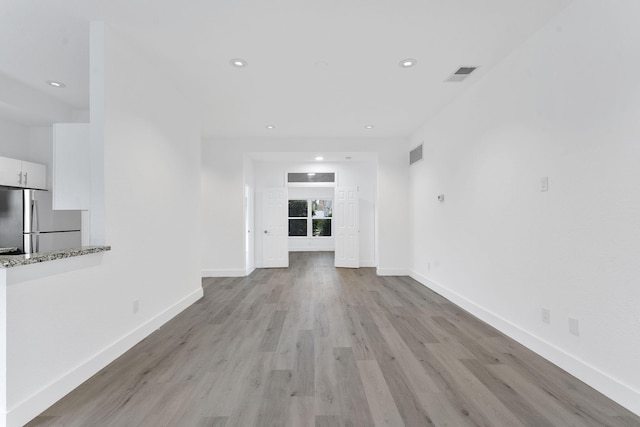 23157 Old Inlet Bridge Dr, Boca Raton, FL 33433 - unfurnished living room with light wood finished floors and recessed lighting