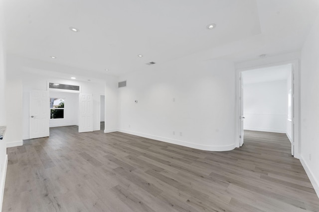 23157 Old Inlet Bridge Dr, Boca Raton, FL 33433 - unfurnished living room featuring light wood-style flooring and recessed lighting