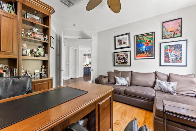 19335 Skyridge Cir, Boca Raton, FL 33498 - living room with light wood finished floors, a ceiling fan, and a desk