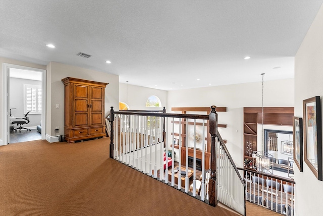 19335 Skyridge Cir, Boca Raton, FL 33498 - hall with an upstairs landing, carpet floors, recessed lighting, plenty of natural light, and a chandelier