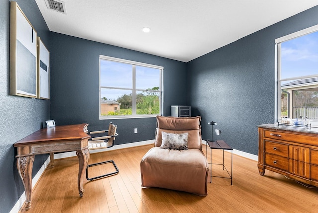 19335 Skyridge Cir, Boca Raton, FL 33498 - office with healthy amount of natural light, a textured wall, and wood finished floors