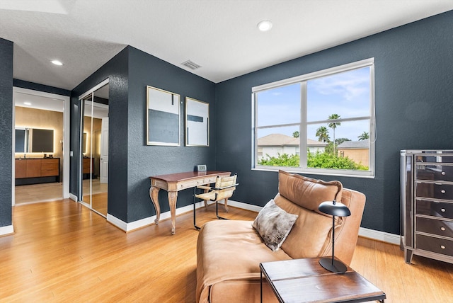 19335 Skyridge Cir, Boca Raton, FL 33498 - home office featuring a textured wall, wood finished floors, and recessed lighting