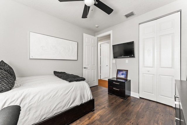 19335 Skyridge Cir, Boca Raton, FL 33498 - bedroom featuring dark wood-type flooring, ceiling fan, and a closet