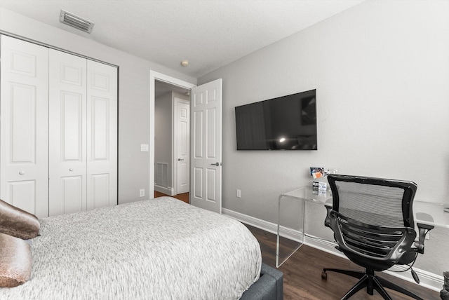 19335 Skyridge Cir, Boca Raton, FL 33498 - bedroom featuring a closet, dark wood finished floors, and an office area