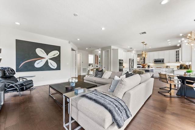 19335 Skyridge Cir, Boca Raton, FL 33498 - living room featuring dark wood-type flooring, a chandelier, and recessed lighting