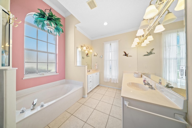 1104 SE Strathmore Dr, Port Saint Lucie, FL 34952 - full bath with ornamental molding, a garden tub, two vanities, and tile patterned floors