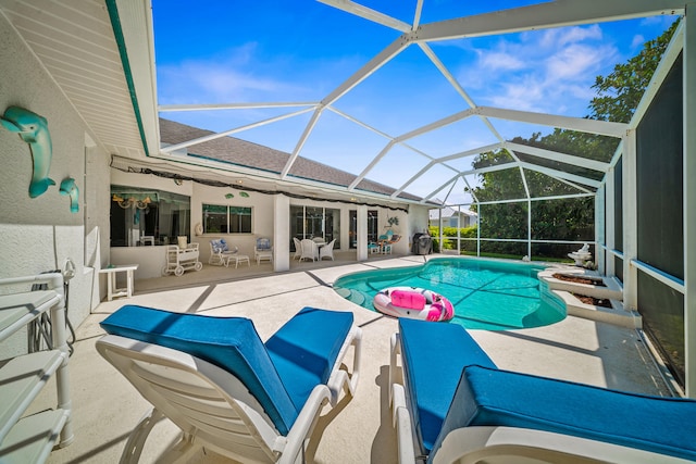 1104 SE Strathmore Dr, Port Saint Lucie, FL 34952 - outdoor pool featuring a patio area and glass enclosure