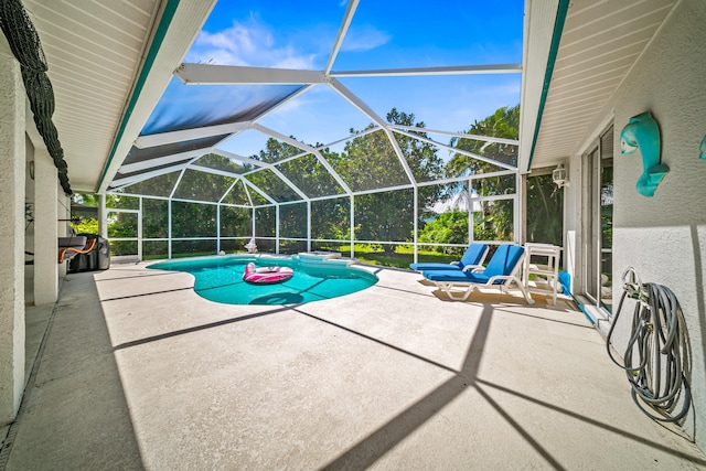 1104 SE Strathmore Dr, Port Saint Lucie, FL 34952 - outdoor pool with a patio area and glass enclosure