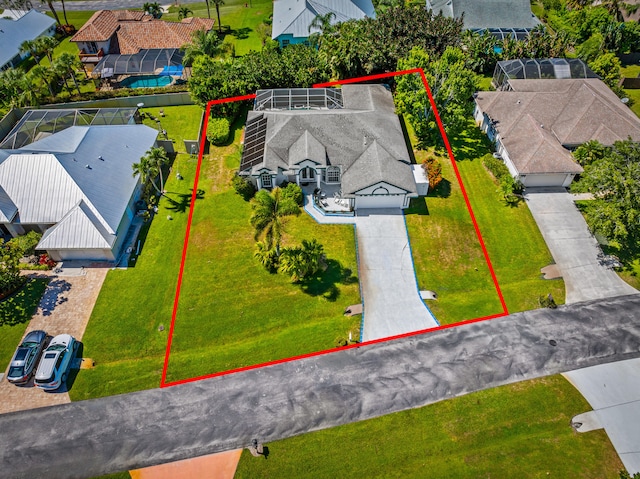 1104 SE Strathmore Dr, Port Saint Lucie, FL 34952 - aerial perspective of suburban area with property boundaries highlighted