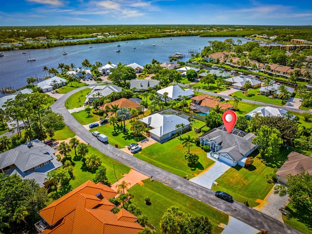 1104 SE Strathmore Dr, Port Saint Lucie, FL 34952 - aerial perspective of suburban area with a nearby body of water