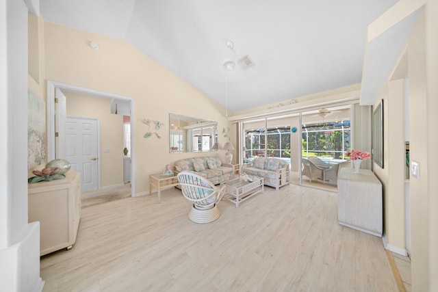 1104 SE Strathmore Dr, Port Saint Lucie, FL 34952 - living area with wood finished floors, high vaulted ceiling, and ceiling fan