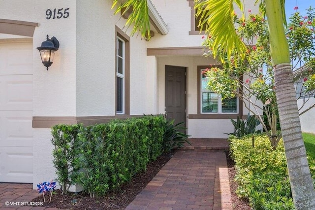 9155 SW Michele Way, Port Saint Lucie, FL 34987 - view of exterior entry with stucco siding