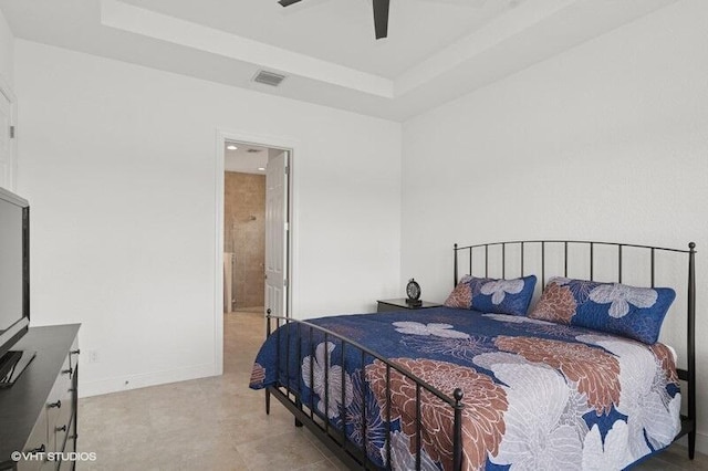 9155 SW Michele Way, Port Saint Lucie, FL 34987 - bedroom featuring a raised ceiling, a ceiling fan, and ensuite bathroom