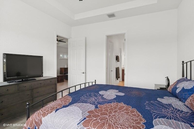 9155 SW Michele Way, Port Saint Lucie, FL 34987 - bedroom with a raised ceiling and connected bathroom