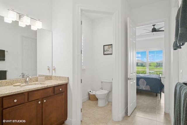 9155 SW Michele Way, Port Saint Lucie, FL 34987 - bathroom featuring vanity, tile patterned floors, ceiling fan, and ensuite bathroom