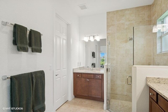 9155 SW Michele Way, Port Saint Lucie, FL 34987 - full bath with vanity, a shower stall, and tile patterned flooring