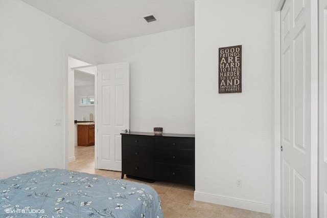 9155 SW Michele Way, Port Saint Lucie, FL 34987 - bedroom featuring light tile patterned floors and baseboards