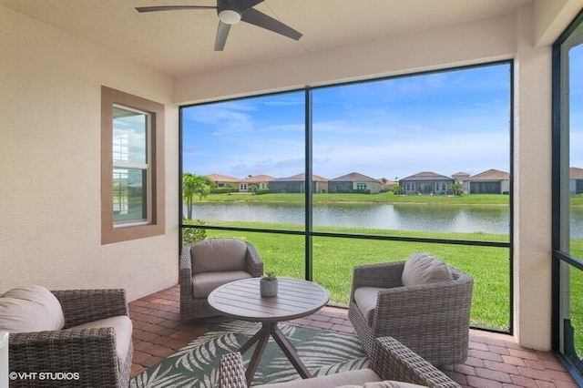 9155 SW Michele Way, Port Saint Lucie, FL 34987 - sunroom featuring ceiling fan, a water view, and a residential view