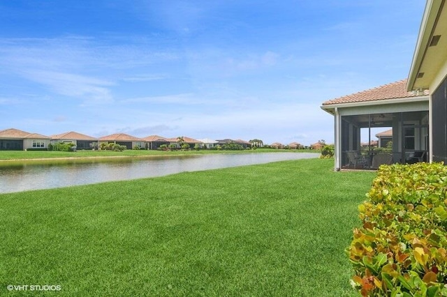 9155 SW Michele Way, Port Saint Lucie, FL 34987 - view of grassy yard with a water view, a sunroom, and a residential view