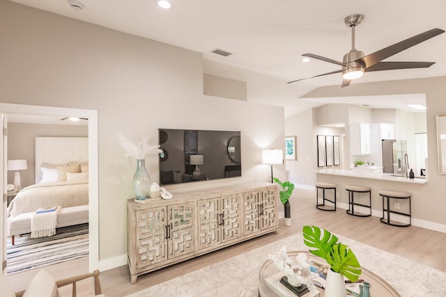 8008 Red Reef Ln, Boynton Beach, FL 33436 - living room with vaulted ceiling, a ceiling fan, light wood-style flooring, and recessed lighting