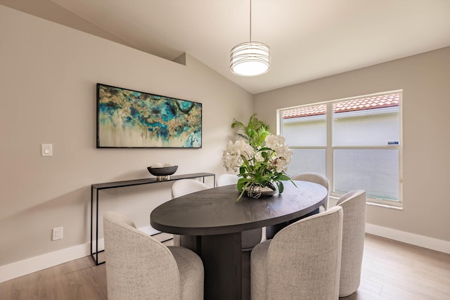 8008 Red Reef Ln, Boynton Beach, FL 33436 - dining space with lofted ceiling and light wood finished floors