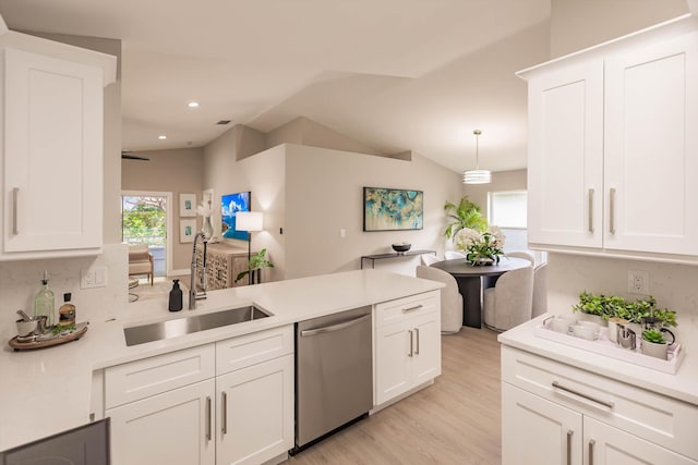 8008 Red Reef Ln, Boynton Beach, FL 33436 - kitchen with stainless steel dishwasher, white cabinets, light countertops, a peninsula, and recessed lighting