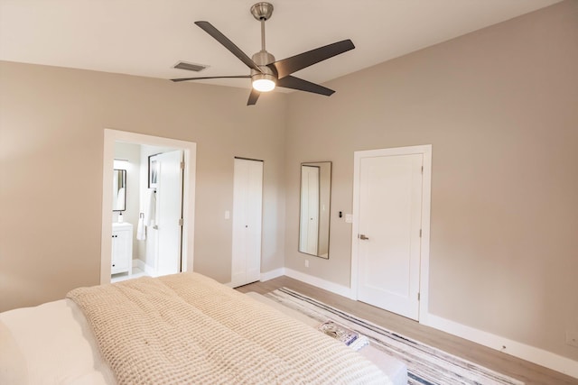 8008 Red Reef Ln, Boynton Beach, FL 33436 - bedroom with vaulted ceiling, light wood finished floors, ensuite bath, and a ceiling fan