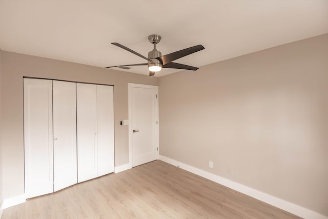 8008 Red Reef Ln, Boynton Beach, FL 33436 - unfurnished bedroom with light wood finished floors, a closet, and ceiling fan