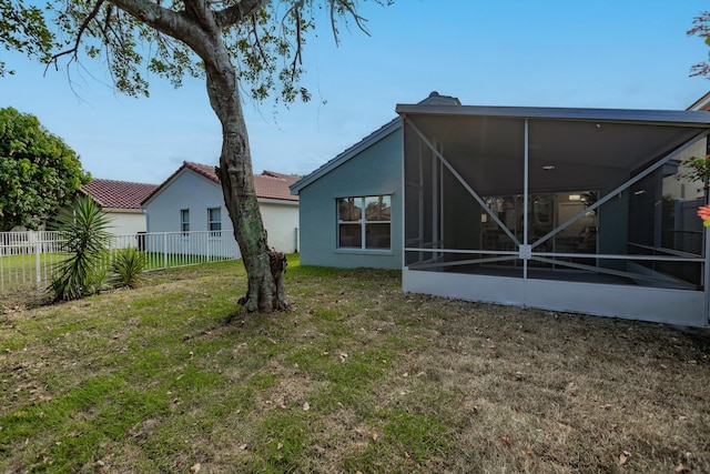 8008 Red Reef Ln, Boynton Beach, FL 33436 - back of house featuring a sunroom and stucco siding