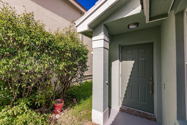 8008 Red Reef Ln, Boynton Beach, FL 33436 - view of exterior entry with stucco siding