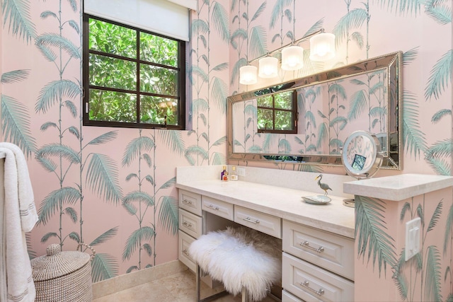 216 Summa St, West Palm Beach, FL 33405 - bathroom with wallpapered walls, vanity, and tile patterned flooring