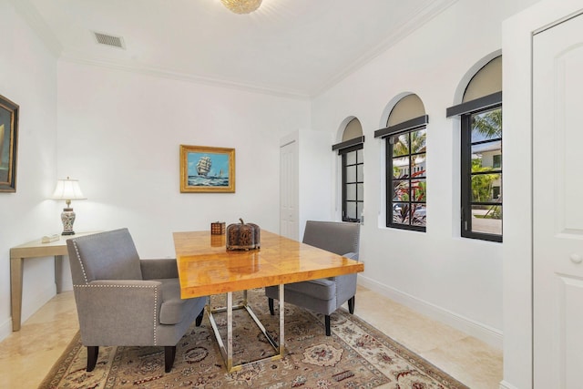216 Summa St, West Palm Beach, FL 33405 - tiled dining space featuring crown molding and baseboards