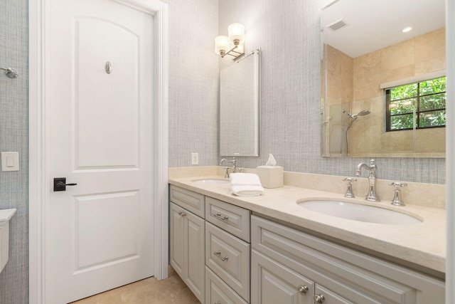 216 Summa St, West Palm Beach, FL 33405 - bathroom with double vanity and tile patterned floors