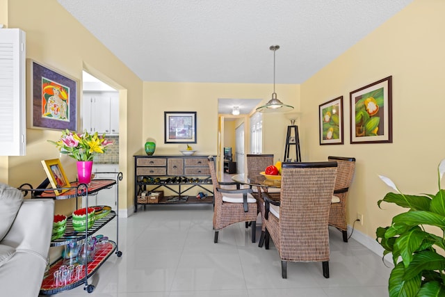 310 Farnham M Unit 310, Deerfield Beach, FL 33442 - dining space with a textured ceiling and tile patterned floors