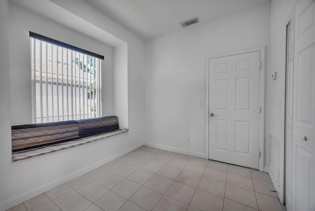 511 SW Treasure Cv, Port Saint Lucie, FL 34986 - unfurnished room with baseboards and light tile patterned floors
