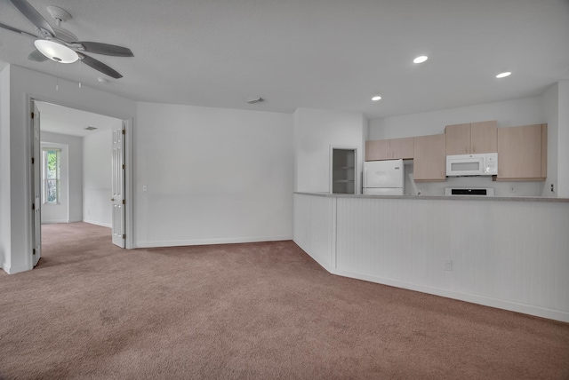 511 SW Treasure Cv, Port Saint Lucie, FL 34986 - unfurnished living room with carpet flooring, recessed lighting, and a ceiling fan