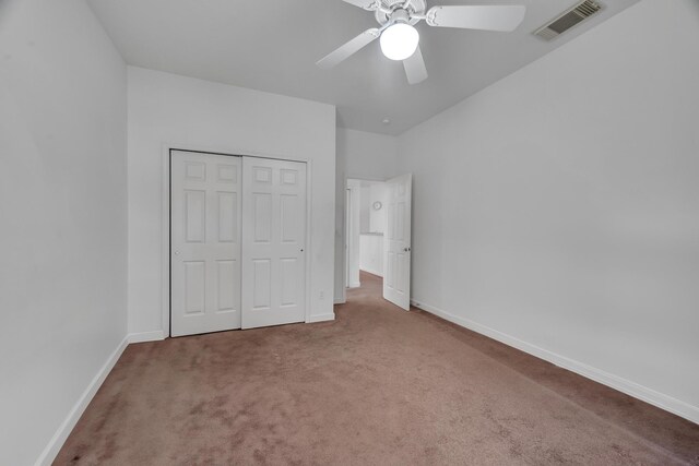 511 SW Treasure Cv, Port Saint Lucie, FL 34986 - unfurnished bedroom featuring carpet flooring, a closet, and ceiling fan