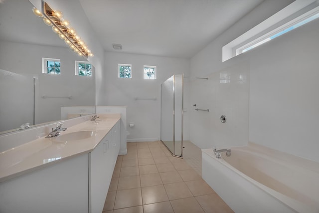 511 SW Treasure Cv, Port Saint Lucie, FL 34986 - full bath featuring double vanity, a walk in shower, a bath, and tile patterned floors