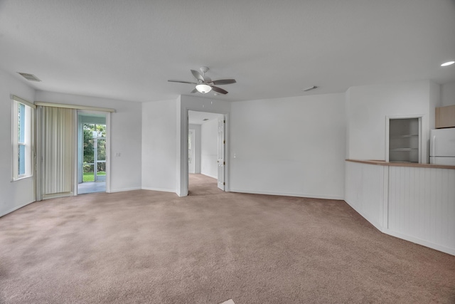 511 SW Treasure Cv, Port Saint Lucie, FL 34986 - empty room with carpet floors and a ceiling fan