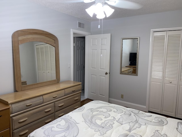 2975 SW 22nd Ave Unit 2010, Delray Beach, FL 33445 - bedroom with a closet, ceiling fan, a textured ceiling, and wood finished floors
