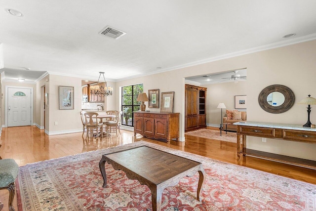 45 Stratford Ln Unit B, Boynton Beach, FL 33436 - living room featuring light wood-style floors, crown molding, and ceiling fan