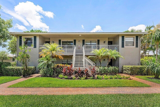 45 Stratford Ln Unit B, Boynton Beach, FL 33436 - view of property featuring stairs