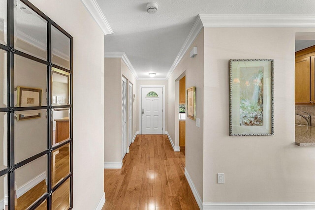 45 Stratford Ln Unit B, Boynton Beach, FL 33436 - corridor with light wood finished floors and crown molding